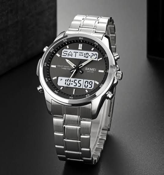 Skmei 2049 dual time 	•	Dual time display (Analog + Digital) 	•	LED backlight 	•	Alarm & stopwatch 	•	Day & date display 	•	12/24 hour format 	•	Water resistant 	•	Durable resin case & strap 	•	Shock resistant design